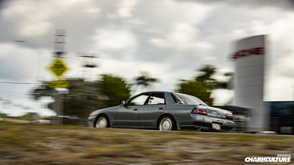 Adrian's Nissan Skyline R32 driving to Cars & Brunch 4 at Champion Porsche